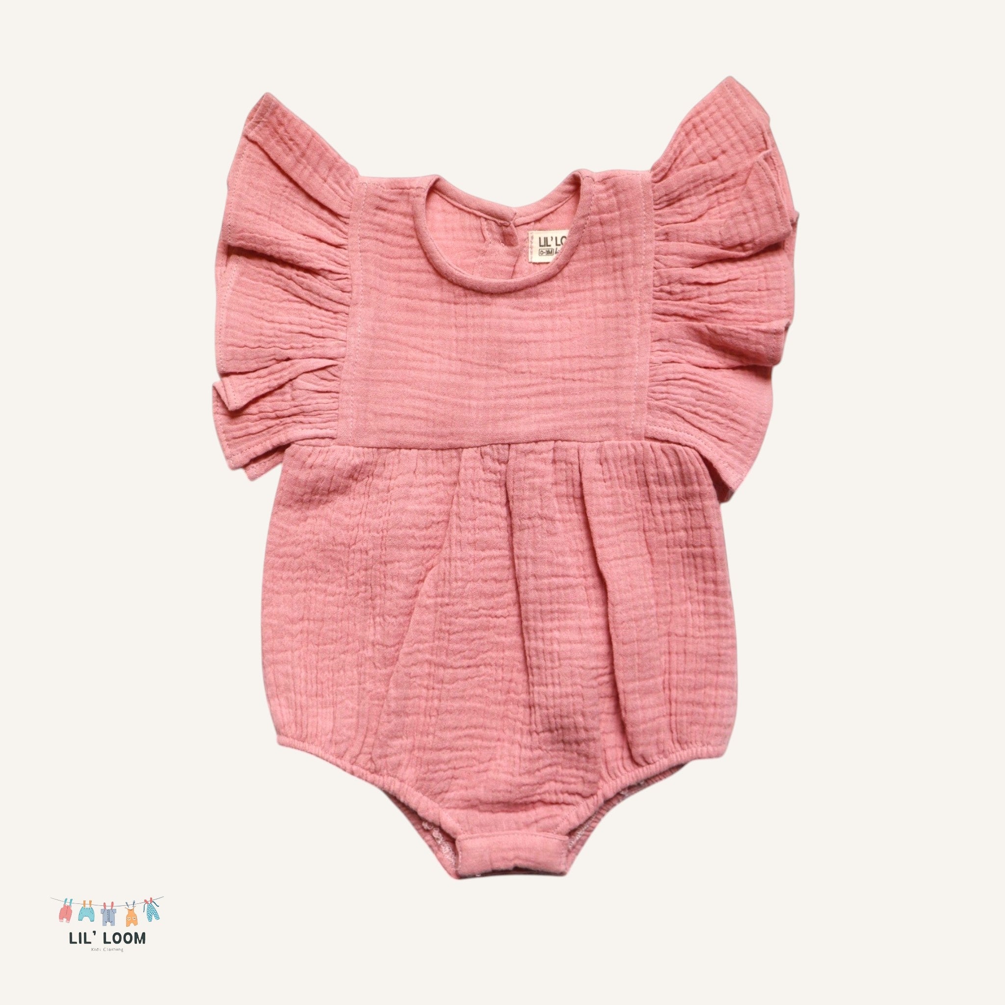 Pink baby romper with ruffled sleeves made of muslin cotton.