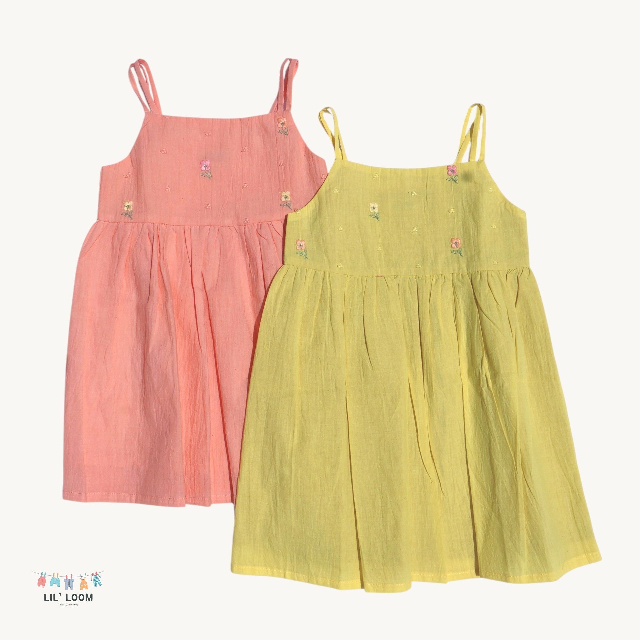 Two children's dresses, one pink and one yellow, on a white background with 'LIL' LOOM' branding.