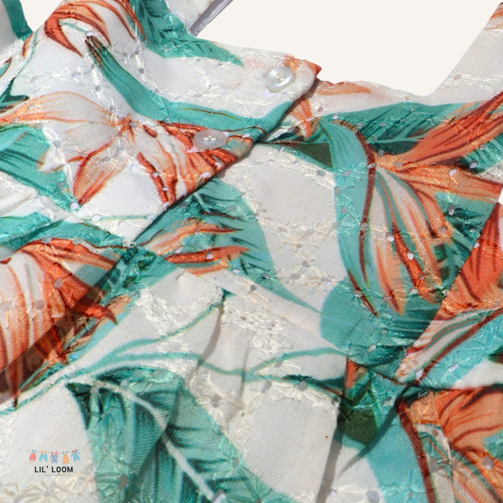 Close-up of a colorful haboka fabric with floral leaf pattern, featuring the brand 'LIL' LOOM'.