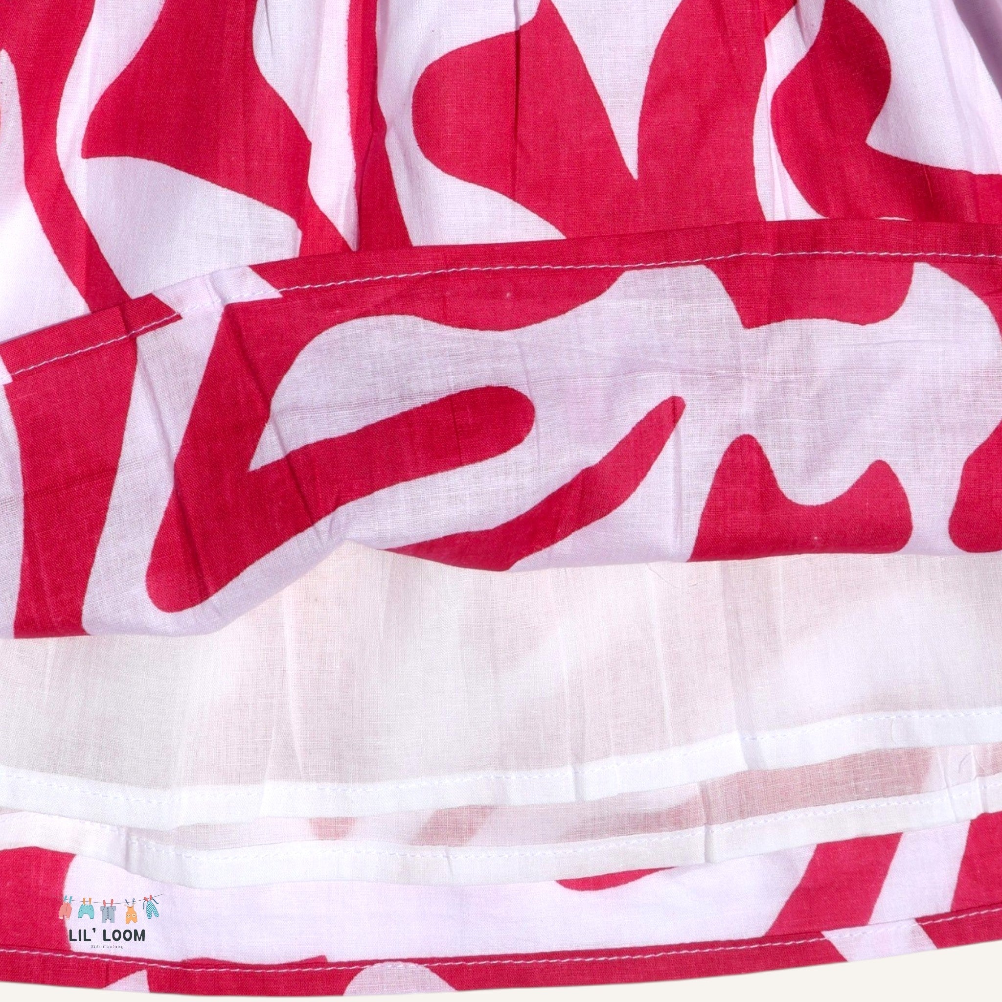 pink and white patterned dress with tied straps for all day breathable comfort