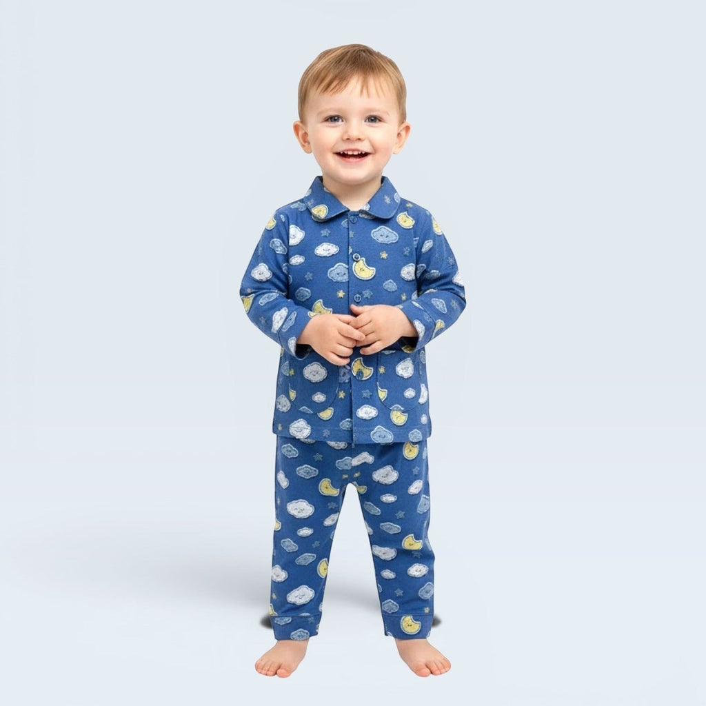Lilloom blue cotton pajama set with moons, clouds, and stars print for boys. Button-front top and elastic waistband pants.