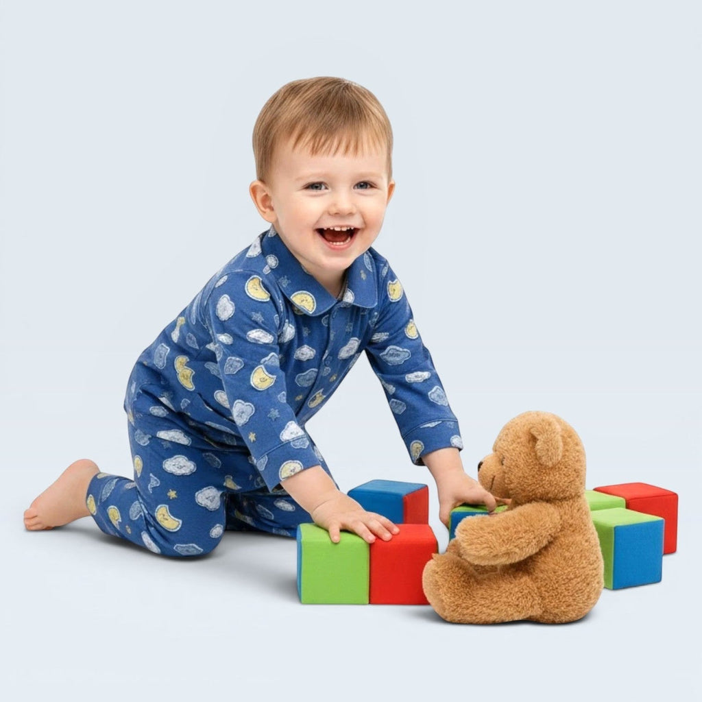 lilloom blue cotton pajama set with moons, clouds, and stars print for boys. Button-front top and relaxed-fit pants.
