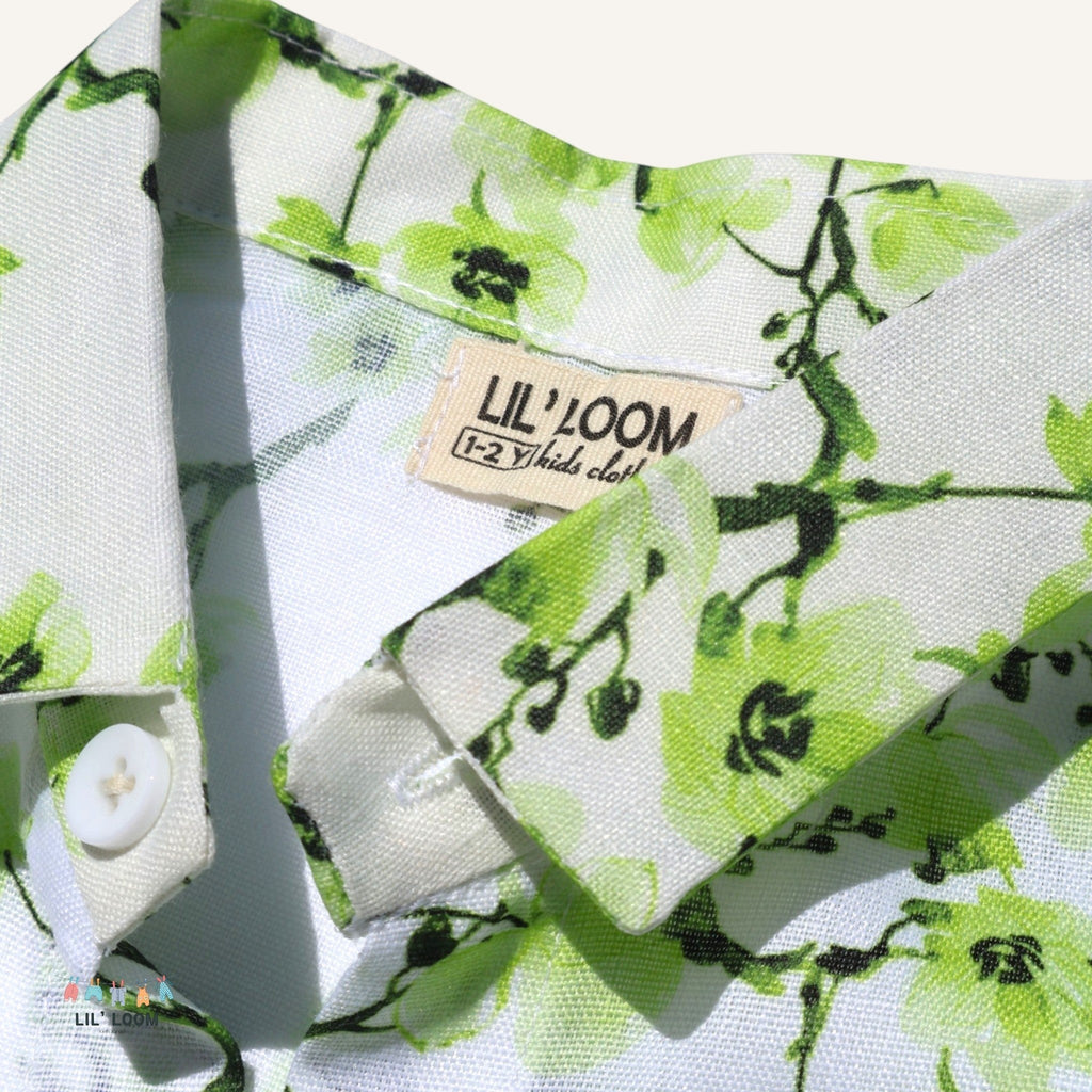 lilloom boys' white cotton shirt with green floral print, button front, collar, and cuff detail.