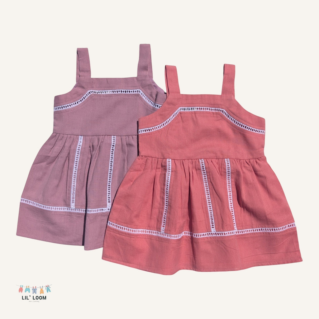 LIL' LOOM Cotton Candy Strap Dress in dusty rose and coral pink, made of 100% cotton with white trim detail.