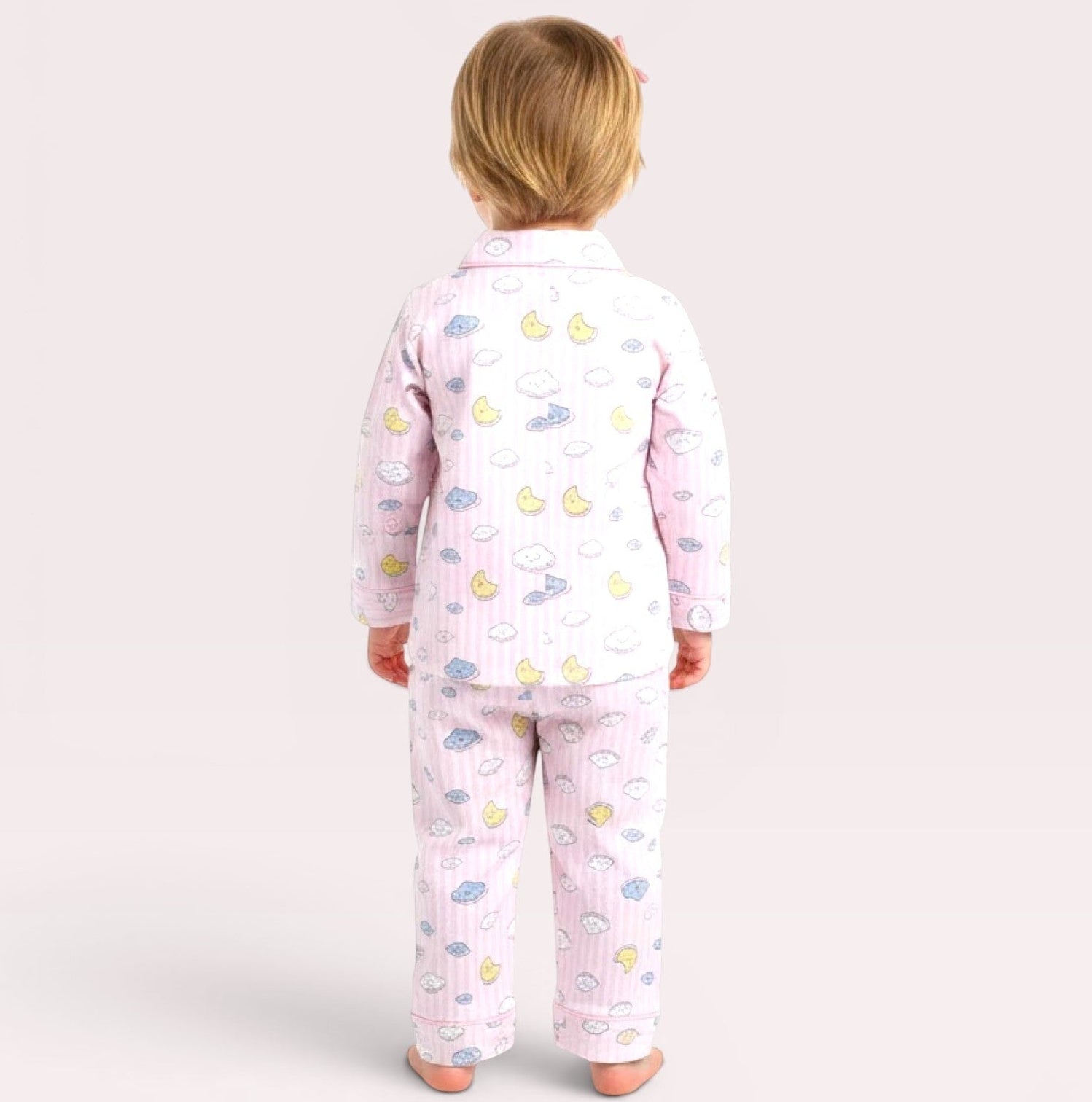 lilloom pink cotton pajama set with clouds, moons, and stars print for girls. Button-front top and elastic waistband pants.
