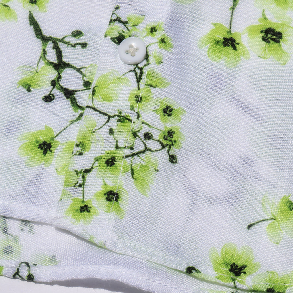 Lilloom Woodland Bloom Boys' Collar Shirt in white with a green floral print. Made of cotton with a button front.